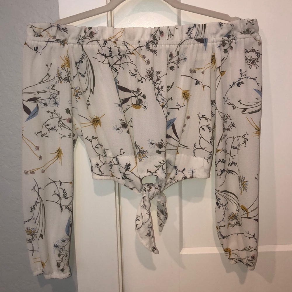 Woman’s off the shoulder cropped blouse.